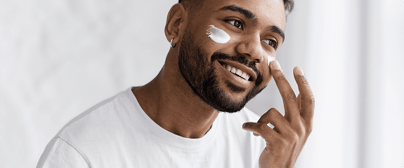 Man applying skincare